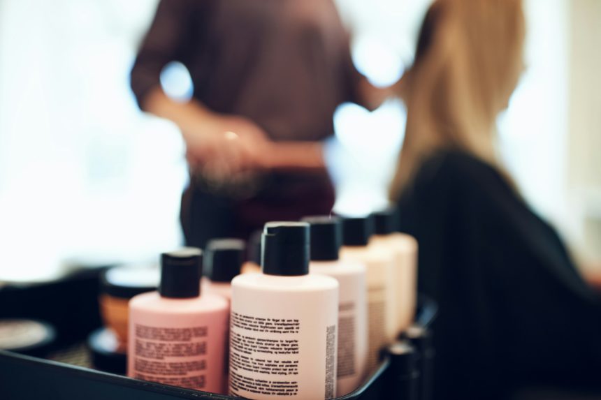 Bottles of styling products in a hair salon