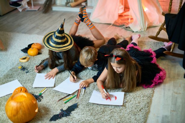 Talented children drawing Halloween pictures