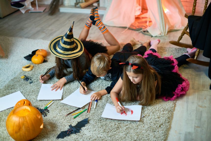 Talented children drawing Halloween pictures